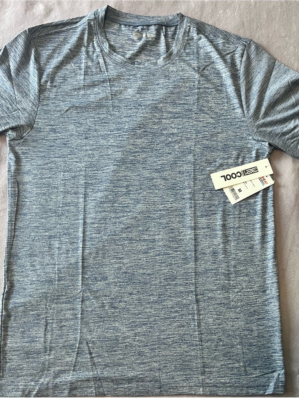 Light blue short sleeve athletic tee. Smooth moisture-wicking